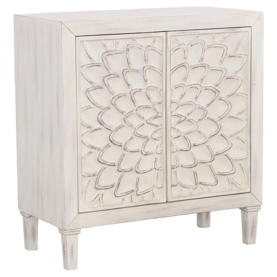 Bring charm and character to your space with this beautifully crafted accent cabinet. Featuring intricately carved floral doors and a distressed white finish, this piece delivers a perfect blend of rustic farmhouse and timeless elegance. Inside, a spaciou