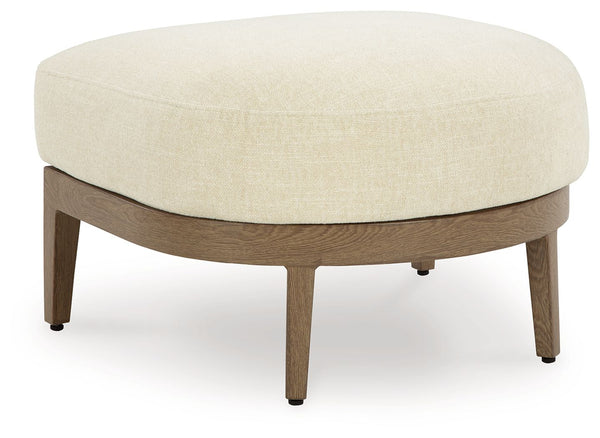 Elevate the appeal of easy-breezy living with this outdoor ottoman. Made to look like wood yet durable enough to weather the elements, it-'s sure to serve you and your besties well, year after year. The gentle curve of the frame is echoed in the cushion, 