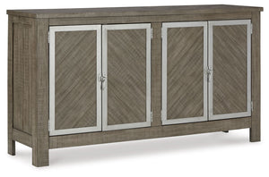 The use of mixed materials on this urban-inspired double buffet makes it a true statement piece. Made of wood with metal accents, this buffet features two spacious cabinets, each with an adjustable shelf and metal framed doors with trend-right window latc