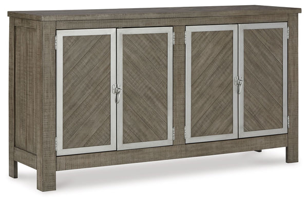 The use of mixed materials on this urban-inspired double buffet makes it a true statement piece. Made of wood with metal accents, this buffet features two spacious cabinets, each with an adjustable shelf and metal framed doors with trend-right window latc