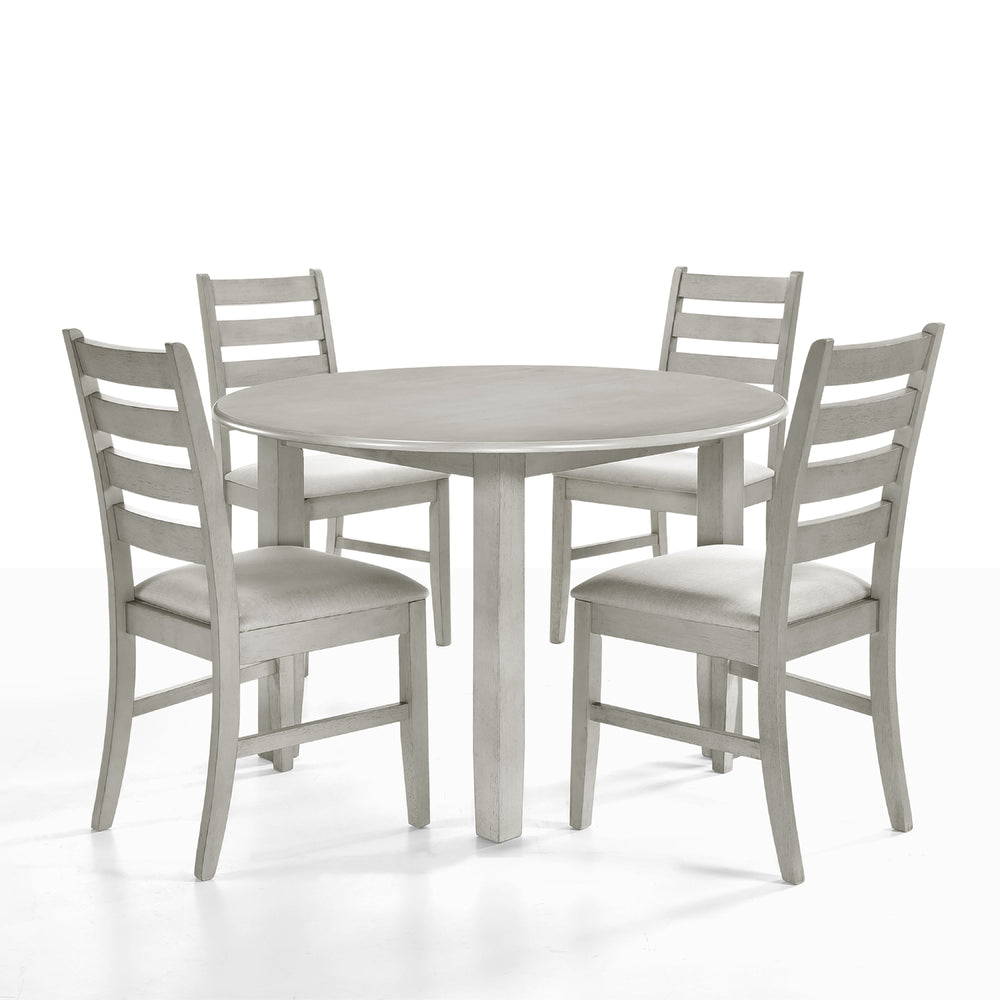Experience the Pascal 5 Piece Dining Room Set in Driftwood Gray, featuring a round wood table and four dining chairs. Crafted from a blend of solid Rubberwood and manufactured woods, this set ensures long-lasting durability. The solid wood chairs are rein
