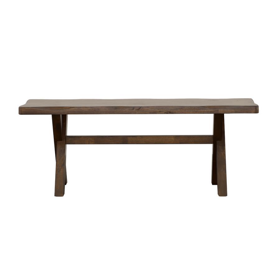 Crafted from solid rubberwood, this dining bench embodies rustic charm with its knotty nutmeg finish and worn edges that highlight the natural beauty of wood. The sturdy trestle-style base provides reliable support, while the smooth, contoured seat offers