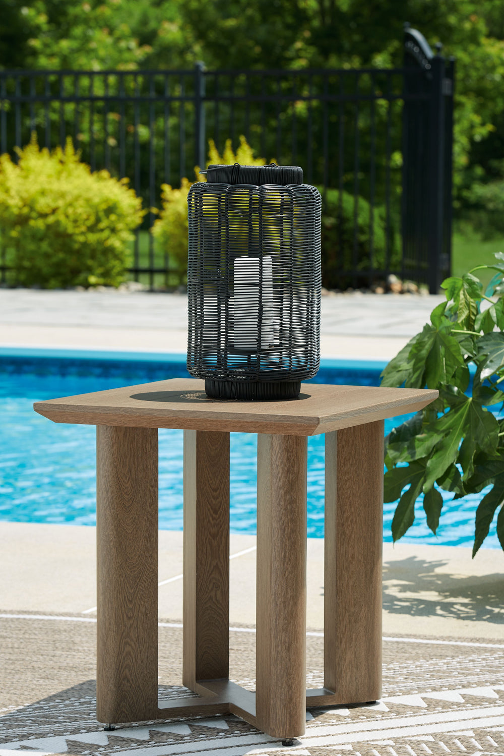 Elevate the appeal of easy-breezy living with the Serene Bay outdoor end table. Made to look like wood yet durable enough to weather the elements, this table is sure to serve you and your besties well, year after year. Its cool character is made for warm 