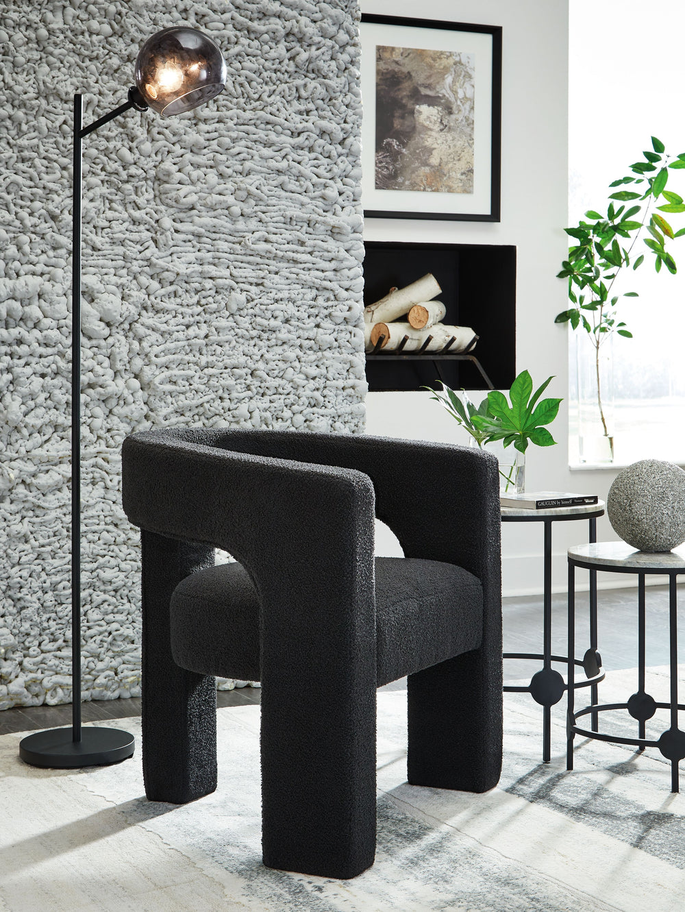 With its sculptural silhouette and barrel-back design, this accent chair exudes runway-inspired style. Peek-a-boo styling and decadent boucle upholstery combine both fashion and comfort seamlessly. Who says cutouts are just for your wardrobe?<br><br><b>Ad