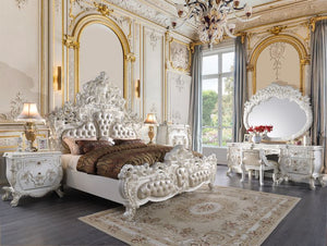 Luxurious style, sophisticated charm, and lustrous finishes are all included in the Vanaheim Bedroom Collection. Extravagant scroll floral design with gold trim accent creates classic appeal and timeless silhouettes. Button tufted headboard and footboard 
