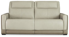 Double down on sleek style with this power reclining sofa. It has a streamlined, space-conscious appeal, with two-tone upholstery in neutral hues creating subtly striking visual intrigue. And with one-touch reclining, adjustable headrests and wireless cha