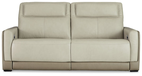 Double down on sleek style with this power reclining sofa. It has a streamlined, space-conscious appeal, with two-tone upholstery in neutral hues creating subtly striking visual intrigue. And with one-touch reclining, adjustable headrests and wireless cha