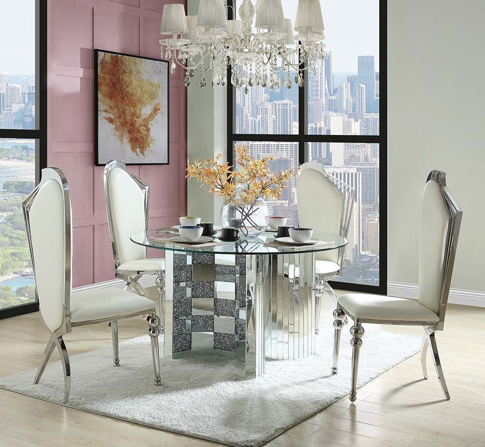 The round Ningbo dining table features an eye-catching checkboard design with faux diamonds and paneled mirrors for a contemporary glam appeal. The sturdy half-circle base securely holds a clear tempered glass tabletop, allowing the base to be the star of