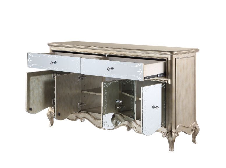 Every piece in the Esteban dining collection reflects vintage glam style! Gorgeous details such as raised scroll trim and crystal handles with mirrored fronts on the case pieces transform the entire collection into something extraordinary. The antique cha