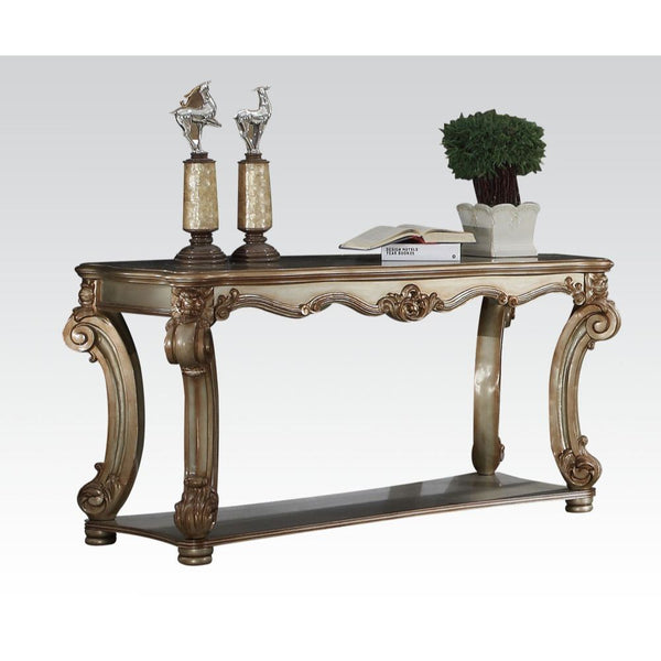 KD, Rectangular Table w/Scrolled Leg and Bottom Shelf â€¢ Top Apron: Scrolled Decor Trim<br/><br/><b>Product Features</b><ul><li>Case: 1Pc/1Ctn</li><li>Finish: Gold Patina</li><li>Style: Vintage</li><li>Materials: Wood, Poly Resin, Veneer (Wood), Composit