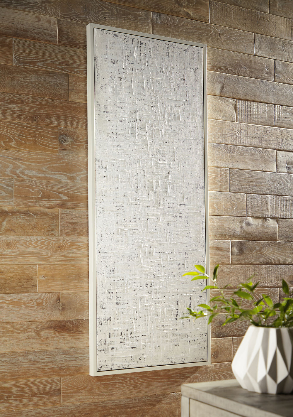 Restrained and refined in design, this wall art offers a new take on neutral. The textural appeal of the abstract piece elevates your decor and creates a curated look worth celebrating. And with four ways to hang it, you have endless options when it comes