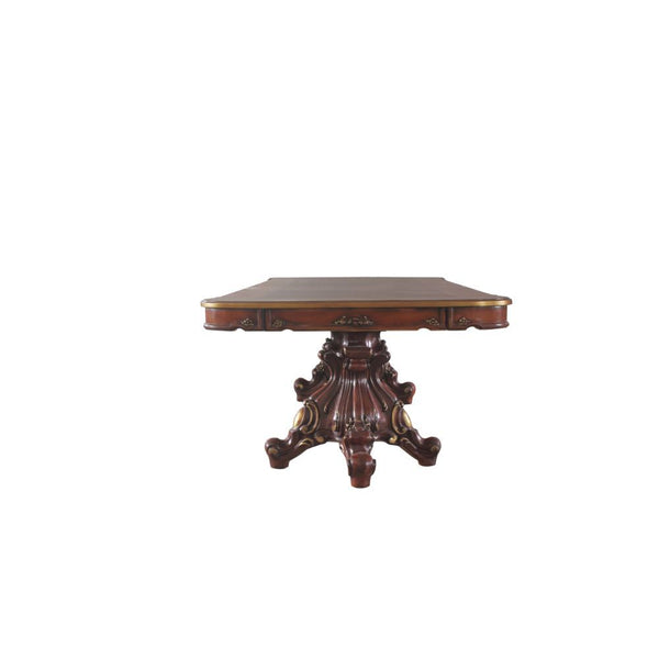  and ends in four oversized scrolled legs. The rectangular wooden top features a parquet lo