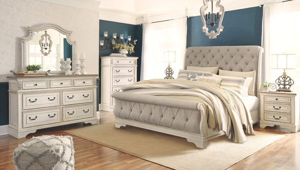 Traditional cottage design. Antiqued two-tone finish featuring chipped white cases with distressed wood finished tops. Tops feature Oak veneers, while the cases are made with engineered wood substrates and Poplar solids. Framed drawer fronts and overlay d