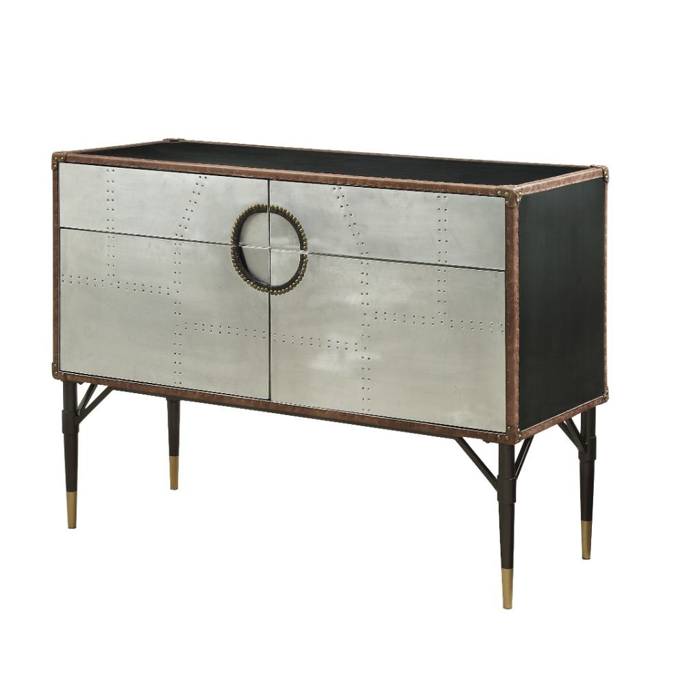 With its riveted patchwork of polished aluminum, the Brancaster console table is inspired by mid-20th-century air travel. This unique console piece features ample storage with two drawers and cabinet space with two doors, all supported by tapered metal le