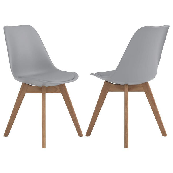 Elevate your dining space with this sleek, mid-century modern side chair. Featuring a smooth, grey faux leather seat and angled oak wood legs, it delivers style and durability. The padded shell offers lasting comfort, while the heat- and stress-resistant 