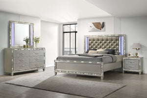 Discover the Radiance Queen 4 Piece Bedroom Set, comprising a Bed, Dresser, Mirror & Nightstand, meticulously crafted for enduring stability and durability from a combination of Solid Rubberwood and manufactured woods. Its semi-gloss lacquer Platinum Silv