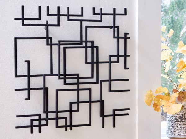  this wall sculpture is sure to add an artistic note to your modern interior. Its abstract style incorporates squares overlapping with fragmented lines in a black finish