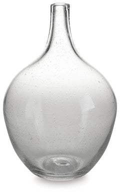 Infuse your shelf, mantel or tabletop with casual charm. Crafted from clear seeded glass, this vase effortlessly captures the essence of weathered beauty. Whether it-'s indoors or outdoors, this vessel is enchantingly simple unadorned or filled with your 