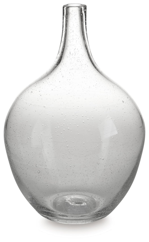 Infuse your shelf, mantel or tabletop with casual charm. Crafted from clear seeded glass, this vase effortlessly captures the essence of weathered beauty. Whether it-'s indoors or outdoors, this vessel is enchantingly simple unadorned or filled with your 
