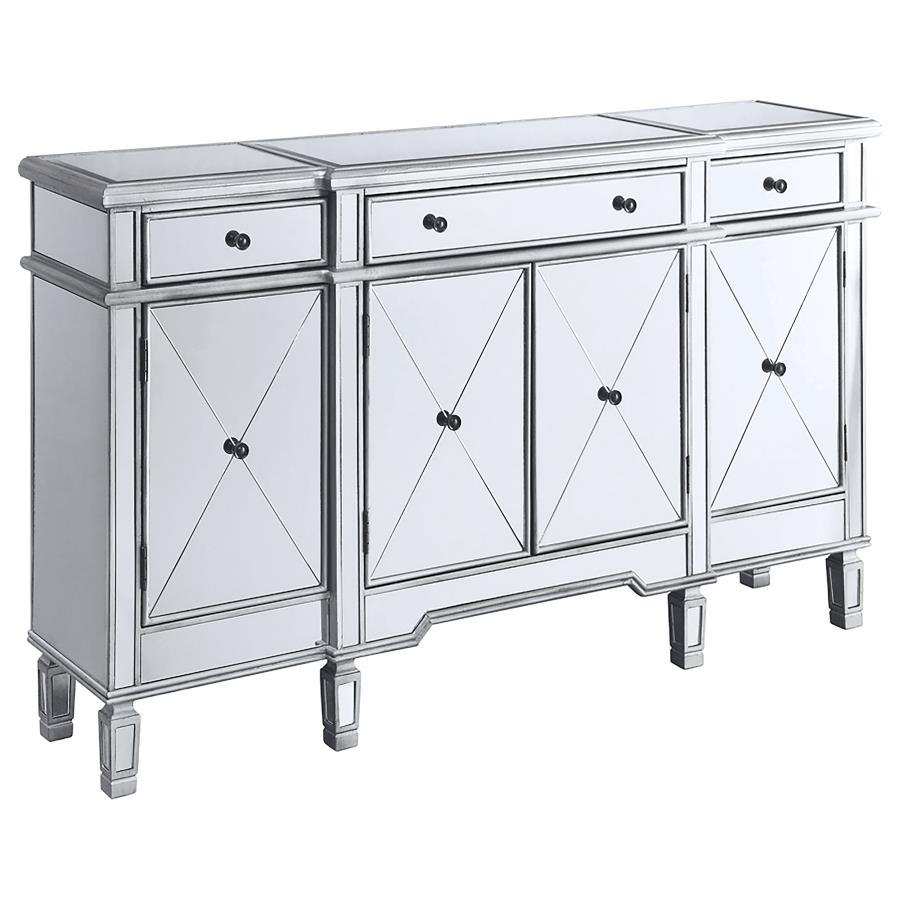 This accent cabinet offers a striking mix of function and glamour with its mirrored surface and silver finish. Framed in engineered wood, the cabinet features four doors with beveled mirrored panels and three top drawers for added storage. Inside, fixed s