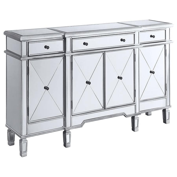This accent cabinet offers a striking mix of function and glamour with its mirrored surface and silver finish. Framed in engineered wood, the cabinet features four doors with beveled mirrored panels and three top drawers for added storage. Inside, fixed s