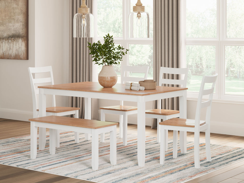 Complement your homeâ€™s simply relaxed sensibility with this dining table, chairs and bench. A crisp white hue offers a chic contrast to the natural wood tone, for a neutral look that vibes with a variety of aesthetics. Whether you-'re sipping your morni
