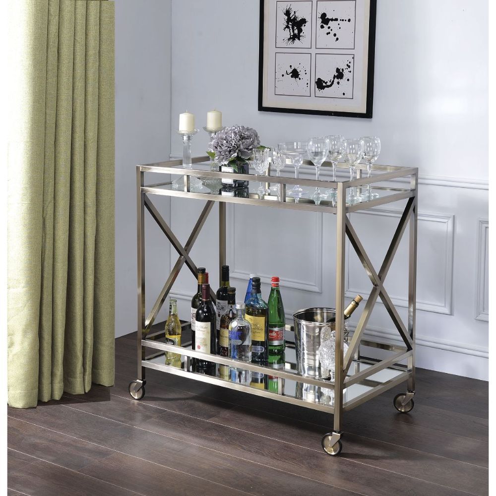 The Kristensen serving cart offers both functionality and superiority for any space in your home. The openwork metal frame finished in antique brass with two-tiered mirror design and the four caster wheelbase effortlessly rolls around. Stack up glossy art