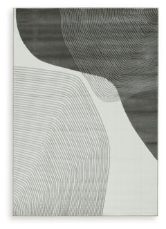 This area rug showcases a swirling abstract motif for a modern look. Providing a soft feeling underfoot, it gives flowing dimension to your hardwood or tile floors. It-'s a perfect fit for any home needing an extra touch of contemporary energy.<br/><br/><