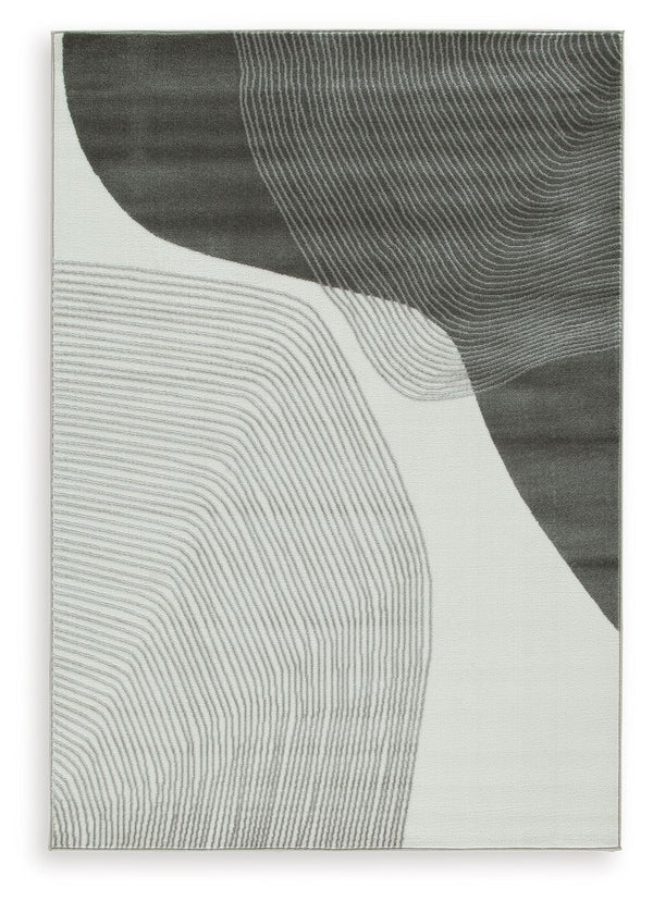 This area rug showcases a swirling abstract motif for a modern look. Providing a soft feeling underfoot, it gives flowing dimension to your hardwood or tile floors. It-'s a perfect fit for any home needing an extra touch of contemporary energy.<br/><br/><
