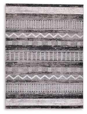 Drawing on tribal weaving motifs, this area rug features a repeating pattern with several unique markings. Its distressed design and neutral palette provide a distinctive look and feel for a variety of interiors, from contemporary to boho chic. Whether in