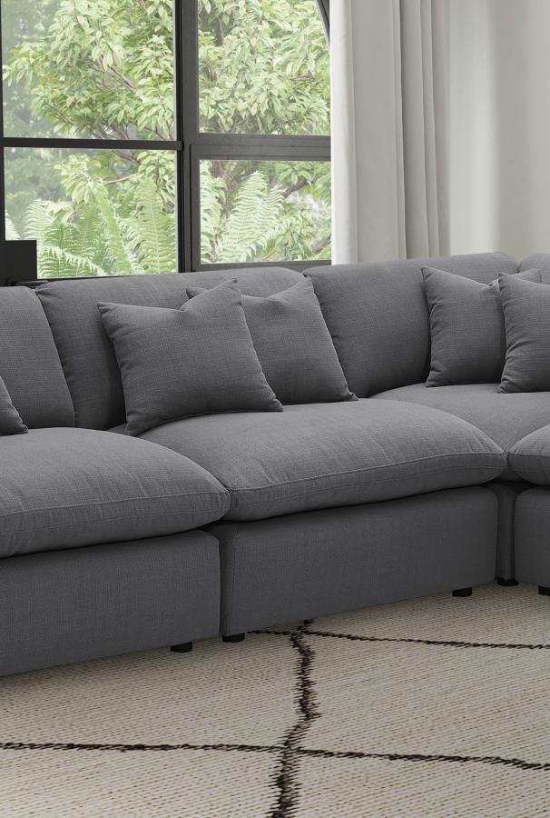 Expand your seating options with this versatile armless chair, designed to be a key component of your modular sectional or as a standalone piece. Upholstered in a rich, charcoal grey performance fabric, this chair offers both style and comfort, with plush