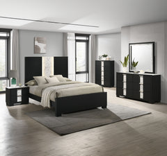 This bedroom set epitomizes modern luxury with its bold, black finish and striking contrast detailing. The bedâ€™s commanding headboard features a chic marble-like accent and integrated lighting, creating an opulent focal point in the room. Complementary 