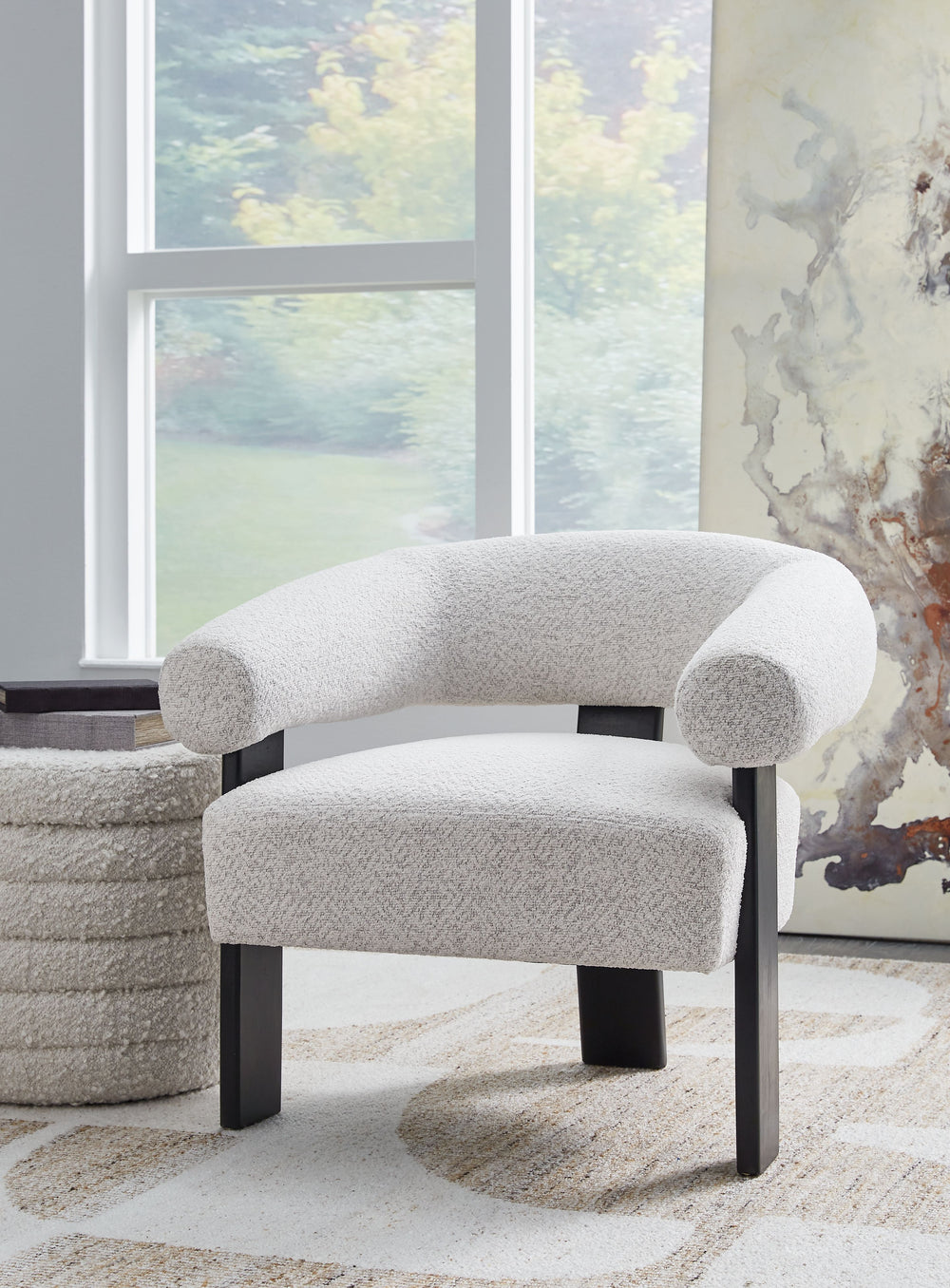 Almost sculptural in design, this accent chair is a standout addition to your seating area. Its artistic form speaks to your eye for unique contemporary design, while the ultra-soft fabric encourages an indulgent lounging experience. In contrasting black 
