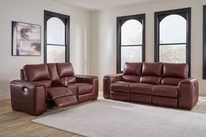 Impressive in scale while keeping an air of refinement, this power reclining sofa and loveseat stuns with soft, supple leather match upholstery in garnet. Sink into real leather in the seating area and inside back while catering to your comfort with one-t
