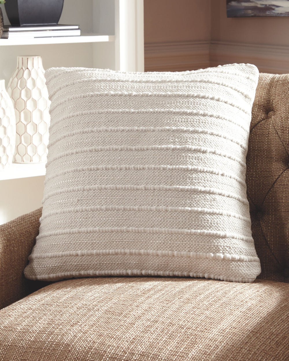 Delighting with handwoven details, this exceptionally versatile accent pillow in cream is truly a dream. Removable, zippered cover makes cleaning a breeze.<br/><br/><b>Product Features</b><ul><li>Cotton/polyester cover</li><li>Zipper closure</li><li>Soft 