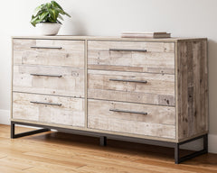 Part beach chic, part urban hip, this dresser is everything you dreamed of, at a comfortably cool price. The butcher block whitewash finish over replicated pine grain lends a richly relaxed aesthetic that suits your sensibility. Dark pewter-tone drawer pu