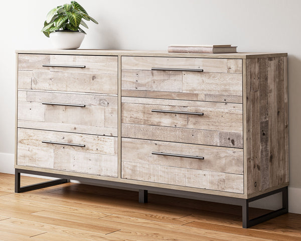 Part beach chic, part urban hip, this dresser is everything you dreamed of, at a comfortably cool price. The butcher block whitewash finish over replicated pine grain lends a richly relaxed aesthetic that suits your sensibility. Dark pewter-tone drawer pu