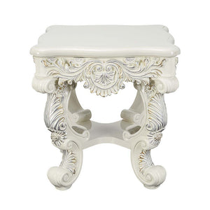  this console table features a round tabletop that is followed by intricate detailing around t