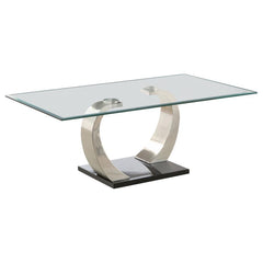 Elevate your living space with this modern coffee table, showcasing a tempered glass top for enhanced durability and style. The dual curved bases feature a brushed satin silver finish, adding sleek contemporary appeal, while the polished black platform ba