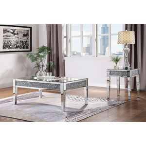 The Noralie Coffee Table will add a contemporary touch to any room in your home. With its clean lines, this brilliant rectangular occasional table showcases a distinctive style for an intriguing look. The table features a fully mirrored beveled frame with
