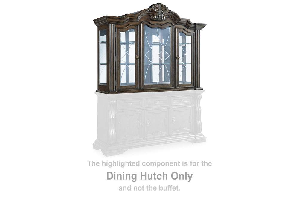 From its ornamental appliques to its large scale, this dining hutch makes a bold statement. With beveled glass windows, LED lighting and a mirrored interior, the opulent piece wows with stunning style. The look is timeless. The feel? Right at home.<br><br