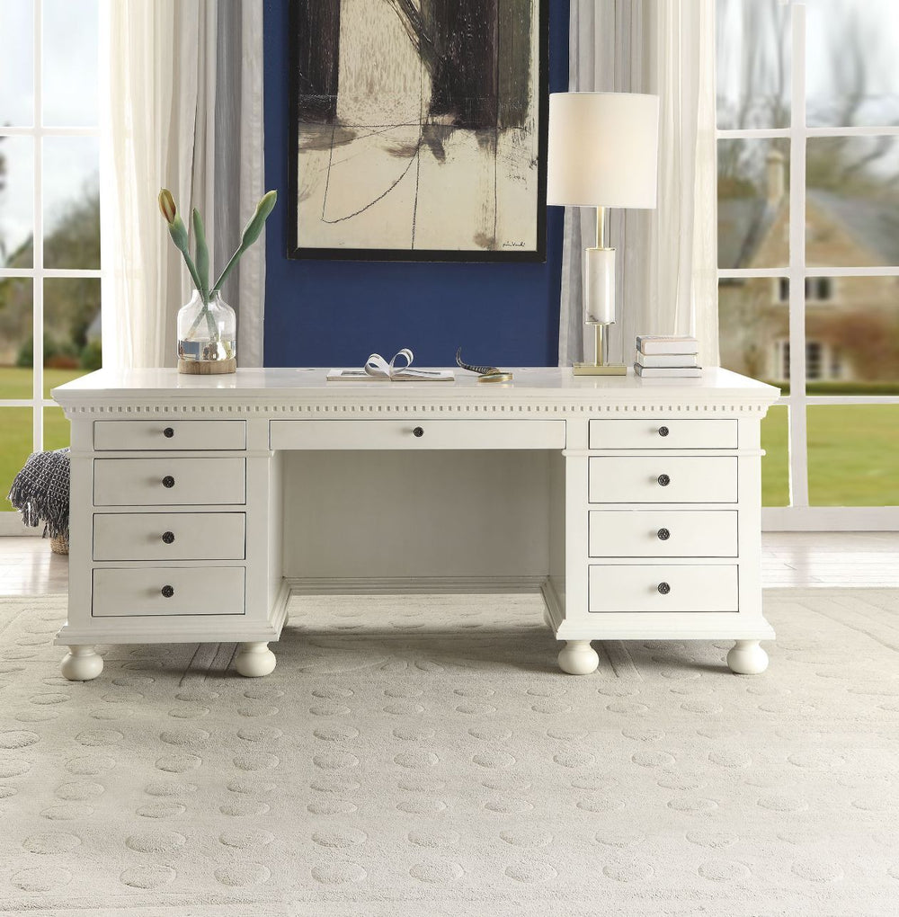 The Gustave Executive Desk is an elegant and versatile piece that can be used both at home and at work. This executive desk features a top and base with molding trim and pre-cut holes with covers for electrical cord management, while the finished back fea