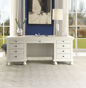 The Gustave Executive Desk is an elegant and versatile piece that can be used both at home and at work. This executive desk features a top and base with molding trim and pre-cut holes with covers for electrical cord management, while the finished back fea