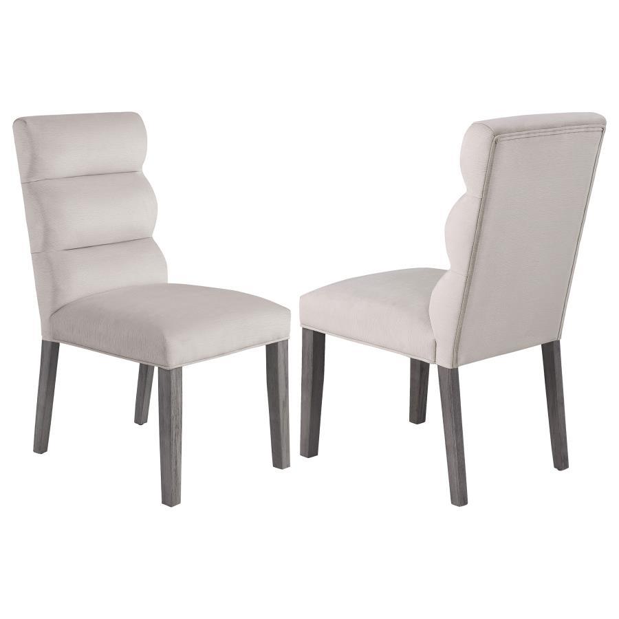 A pillowy look and feel brings ultimate comfort to a casual living space, targeting your kitchen or dining room with a light, floaty vibe, and adding a festive feel. This set of two side chairs checks all the boxes of design, comfort, and easy-living eleg