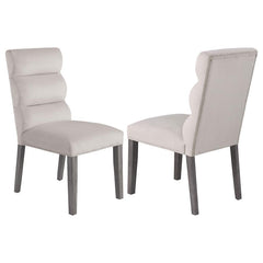 A pillowy look and feel brings ultimate comfort to a casual living space, targeting your kitchen or dining room with a light, floaty vibe, and adding a festive feel. This set of two side chairs checks all the boxes of design, comfort, and easy-living eleg