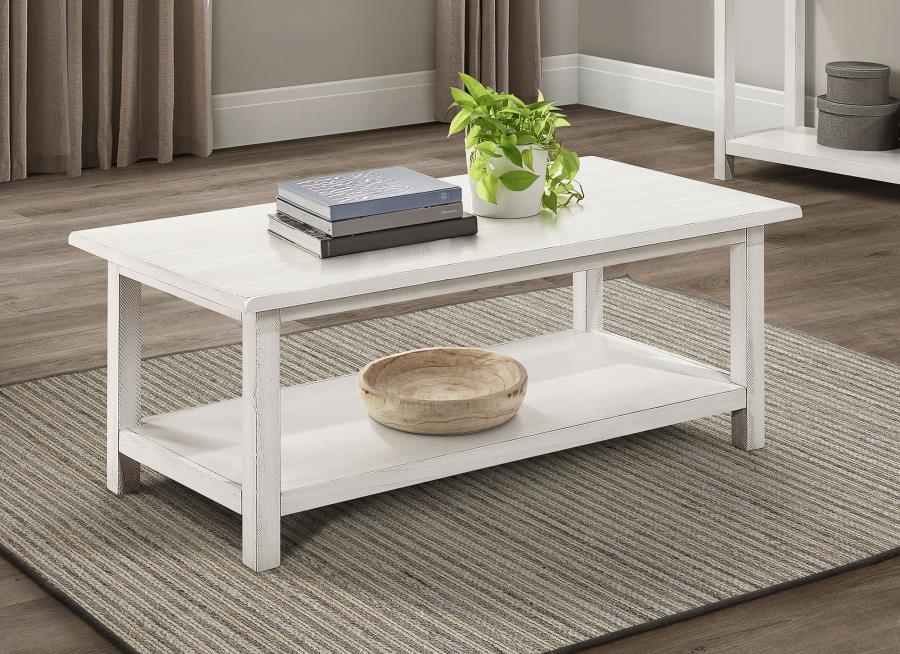 Bring timeless appeal and ample surface space to your living area with this rectangular coffee table. A pine wood and engineered wood construction, enhanced by pine veneer, ensures durability while exuding a warm rustic charm. Its open lower shelf keeps d