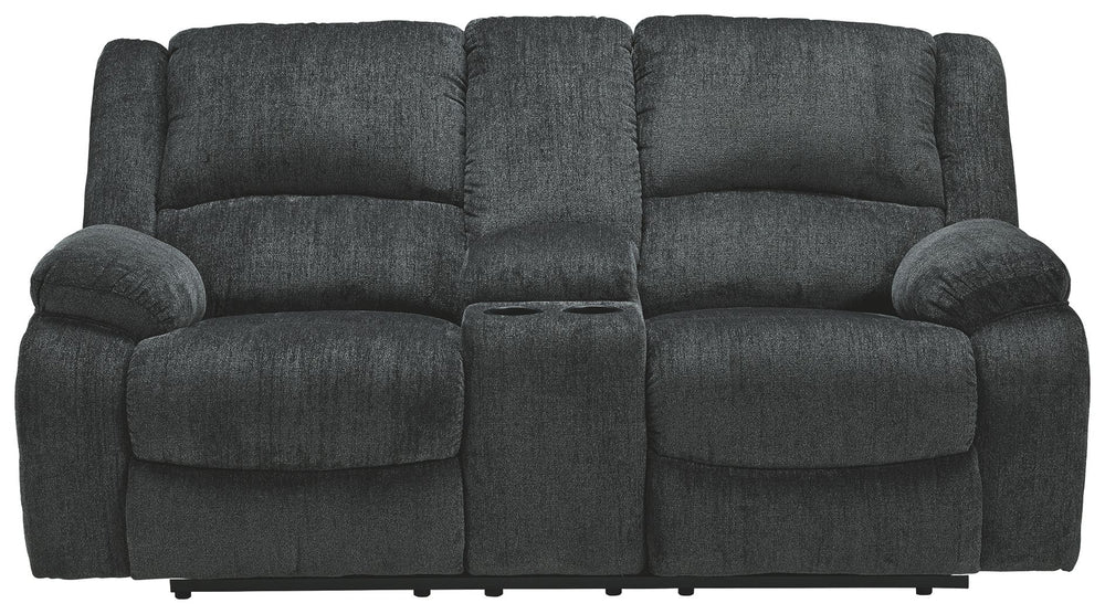 Built for luxury, this reclining loveseat with center console lets you kick back in reliable style. The thick, softly textured chenille upholstery provides a comfy surface on which to lounge. With bustle back construction and thickly cushioned armrests, t