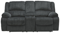Built for luxury, this reclining loveseat with center console lets you kick back in reliable style. The thick, softly textured chenille upholstery provides a comfy surface on which to lounge. With bustle back construction and thickly cushioned armrests, t