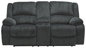 Built for luxury, this reclining loveseat with center console lets you kick back in reliable style. The thick, softly textured chenille upholstery provides a comfy surface on which to lounge. With bustle back construction and thickly cushioned armrests, t