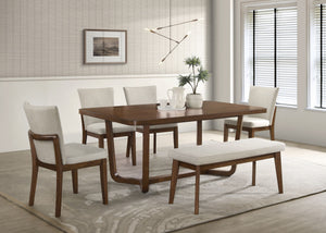 Elevate your dining space with this sleek and sophisticated dining set, designed to seamlessly blend modern elegance with mid-century inspiration. The beautifully crafted table features a warm wood finish and a unique sculptural base, adding a refined tou